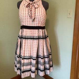 Retro inspired orange polka dot and black dress